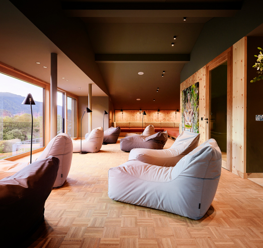 Modern lounge interior with mountain view and contemporary furnishings